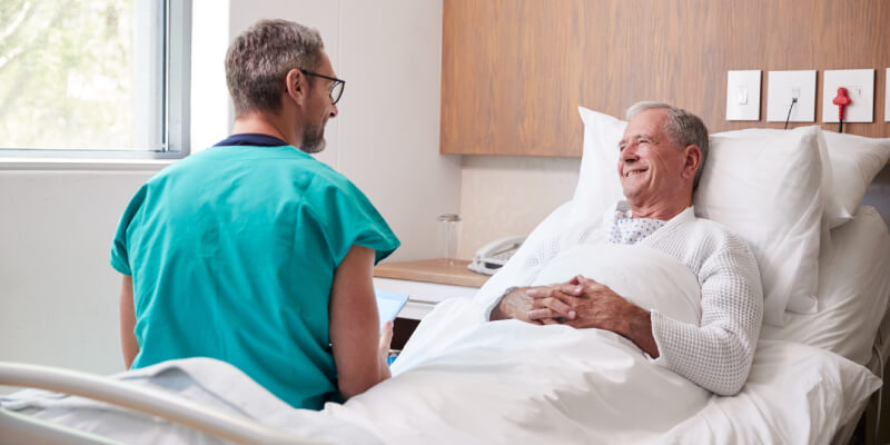 Patient smiling on bed